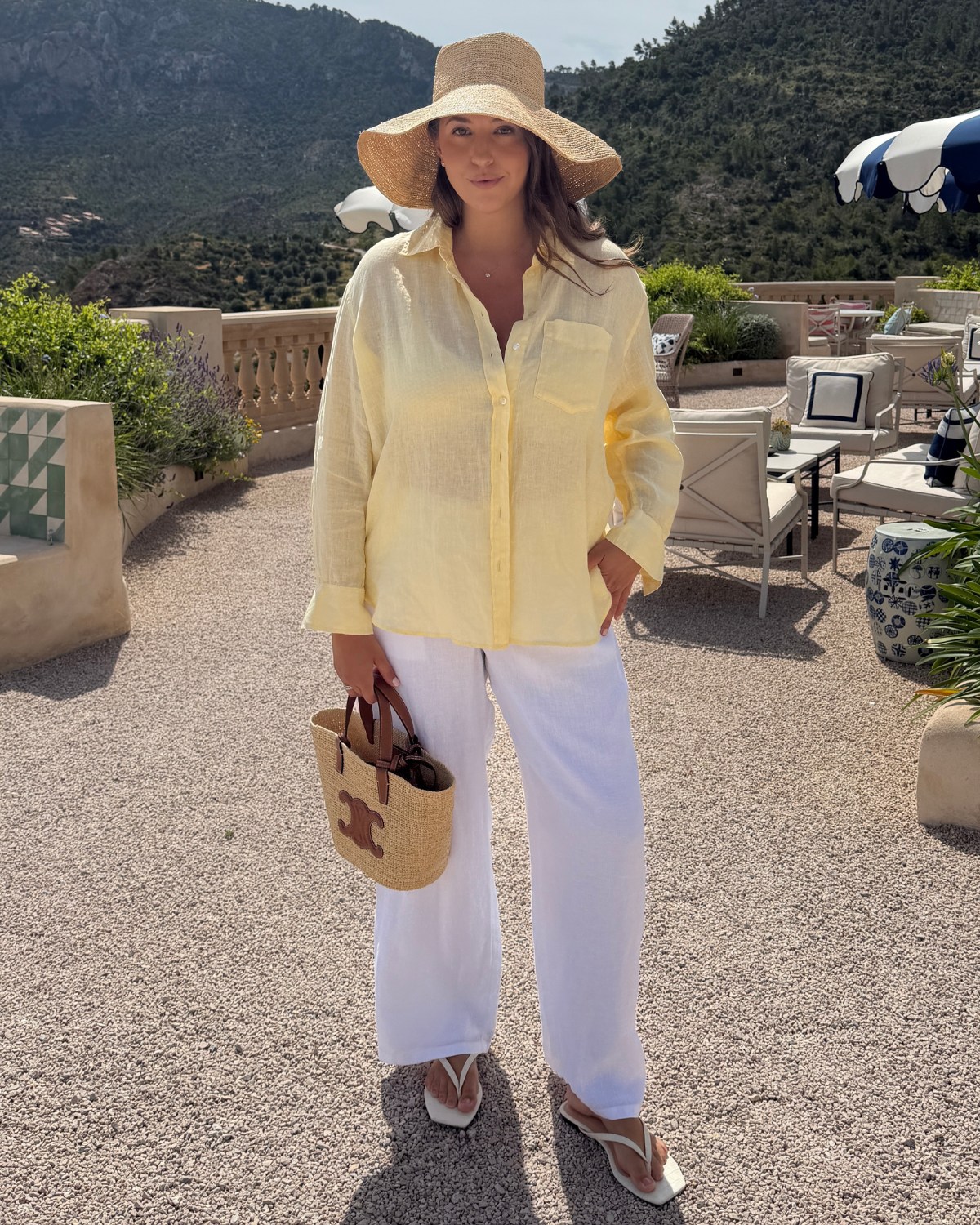 White linen pants outfit with yellow button down shirt
