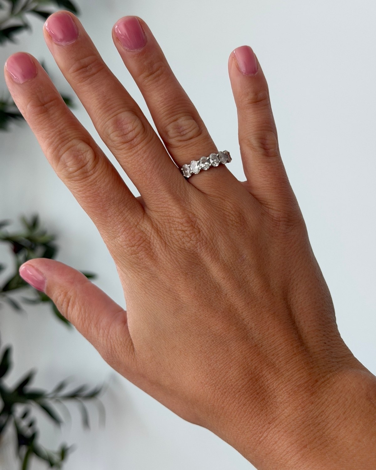 Quince 2-carat lab grown diamond oval seven-stone ring on hand